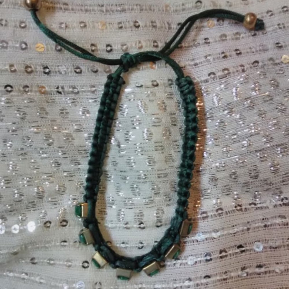 Green bracelet with studded green stones